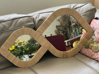 Lot de 2 miroirs en forme d'oeil en raphia, fabrication artisanale au Maroc